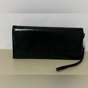 Randolph Duke black clutch bag with a wristlet strap